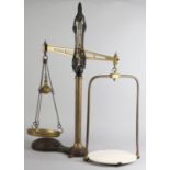 A SET OF VICTORIAN BRASS AND CAST IRON SHOP SCALES, 81cm high