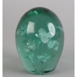 A 19TH CENTURY GREEN GLASS DUMP with nine flowerhead inclusions, 10.5cm high