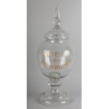 A GLASS IRISH WHISKY DISPENSER and domed cover with spire finial, the bowl cut and etched in gilt