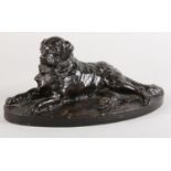 AFTER A* MARTIN (20th century), a bronze sculpture of a long haired-retriever, recumbent on