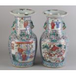 A PAIR OF 19TH CENTURY CHINESE FAMILLE ROSE BALUSTER VASES with everted rims, painted with a