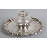 AN EDWARD VII SILVER AND CUT GLASS INKWELL AND CIRCULAR DISHED STAND, Henry Stratford Ltd, Sheffield