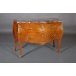 A FRENCH KINGWOOD AND ROUGE MARBLE BOMBÉ COMMODE WITH GILT METAL MOUNTS, serpentine outline, quarter