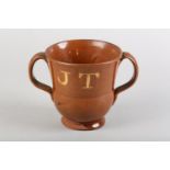 AN EARLY 19TH CENTURY EARTHENWARE LOVING CUP, painted underglaze in white slip 'JT' and 'SB', 13cm