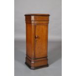 A LATE 19TH CENTURY OAK BEDSIDE CABINET of square outline with canted corners, panel moulded