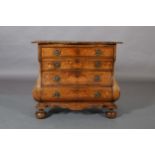A MID 18TH CENTURY DUTCH WALNUT MARQUETRY BOMBÉ COMMODE, inlaid in satinwood with an urn of