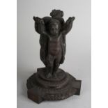 A 19TH CENTURY BRONZE PEDESTAL in the form of three cherubs standing, their arms raised and