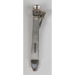 AN ELIZABETH II SILVER FACED ENGINE TURNED CIGAR CUTTER, maker's initials C&C, Birmingham 1990,