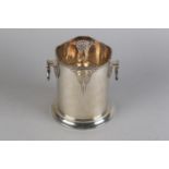 AN ART DECO SILVER TWO HANDLED BOTTLE STAND, Frank Cobb & Co Ltd, Sheffield 1936, stepped rim and