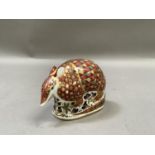 A Royal Crown Derby armadillo paperweight, gold button to underside, 11.5cm long by 8cm high