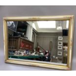 A Portuguese rectangular wall mirror in a cream and gilt moulded frame, hand painted with flowers,