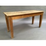 A pine plank topped kitchen table on square tapered legs, 154cm x 52cm