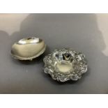 A silver pin dish of flower form on four ball feet by Roberts & Belk, Sheffield 1945, 8.25cm