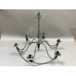 A green metal six sconce chandelier for candles, 65cm drop
