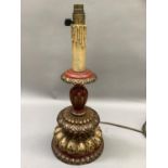 A 1920's painted and gilt wood table lamp, overall height to fitting 44cm, maximum diameter is 18cm