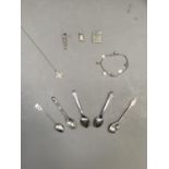A small collection of jewellery including a Cross, two Egyptian pendants, rope link bracelet and
