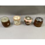 Four various biscuit barrels in wood and ceramic