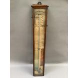 An early 20th century Admiral Fitzroy barometer in a rectangular oak case, 95cm high