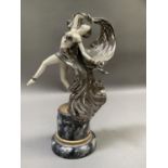 Art Deco style ceramic figure of a dancer with swirling silver lustre skirt and wrap, raised on a