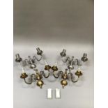 Two pairs of pewter coloured metal twin light wall sconces