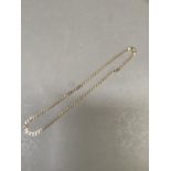A neckchain in 9ct gold faceted curb links, approximate length 45cm, approximate weight 13g