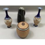 A pair of Doulton Slater lace ware slender vases, a Royal Doulton gilded tobacco jar and cover and a