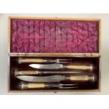 A Victorian five piece antler handled carving set each piece with silver crown terminal and ferrule,