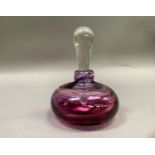 A Jane Charles amethyst and purple swirled glass scent bottle with clear glass stopper, signed to