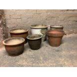 Six various garden planters glazed in browns, dark blue, pale celadon and plain earthenware, various