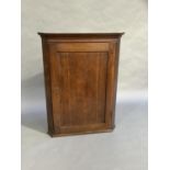 A 19th century oak hanging corner cupboard