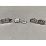 Three pairs of cufflinks, all in white metal (tests as .900 and .800 silver) with continental and