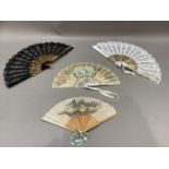 A mother-of-pearl early 20th century fan painted with a romantic couple together with two boxed