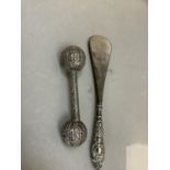 A child's silver rattle shaped as two spheres connected by a bar, tests as silver, weight 0.5oz,