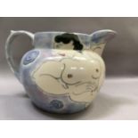 A Heron Cross Pottery jug painted with a female nude against a mottled blue ground, 24cm over handle