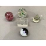 A Caithness paperweight Fleur no. 158, together with two other paperweights, a glass figure of a