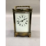 An early 20th century French brass carriage clock, the white dial with Roman numerals, 15cm high