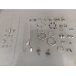 A collection of jewellery in silver and white metal (tests as silver) including bracelets, earrings,
