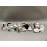 A collection of miniature china including cups and saucers, vases, jugs, model cottage, etc