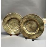 A pair of Chinese brass plaques incised with dragons chasing the flaming pearl, cast with