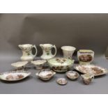 Items of Malingware including a pair of apple blossom jugs and similar vase, various bowls, two