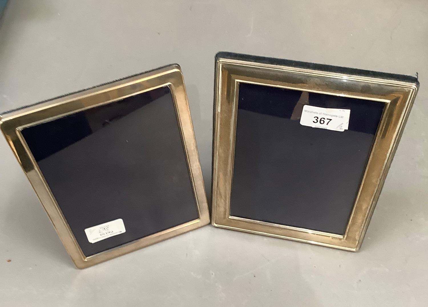 Two Elizabeth II silver photograph frames, rectangular, plain design, 20cm x 15cm and 21cm x 16cm,