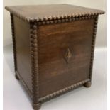 a 1930s oak coal box having beaded rims and corners on compressed bun feet with metal liner, 41cm
