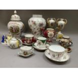 A pair of Dresden style two handled vases raised on plinths, cups and saucers, individual teapot etc