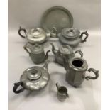 A quantity of Victorian pewter teapots etc