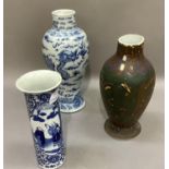 A Chinese blue and white baluster vase painted with opposing dragons chasing the flaming pearl, four