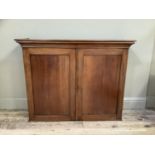 A Victorian mahogany two door cupboard (the upper section from a larger piece of furniture), 113cm