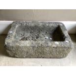 A stone trough 76cm wide x 26cm high x 47cm deep, with drainage hole