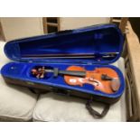 A child's violin labelled 'The Stentor Student I' in good order and complete with bow and lined case