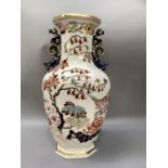 A very large Mason's octagonal baluster two handled vase printed and enamelled with peony and