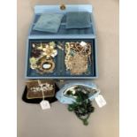 The contents of a blue faux leather jewellery case and two fabric purses including an early 20th